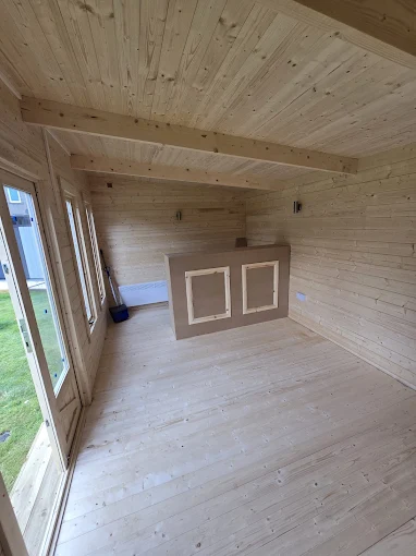Garden room with exposed beams and natural light