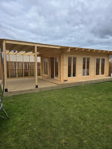 Contemporary garden room with terrace decking